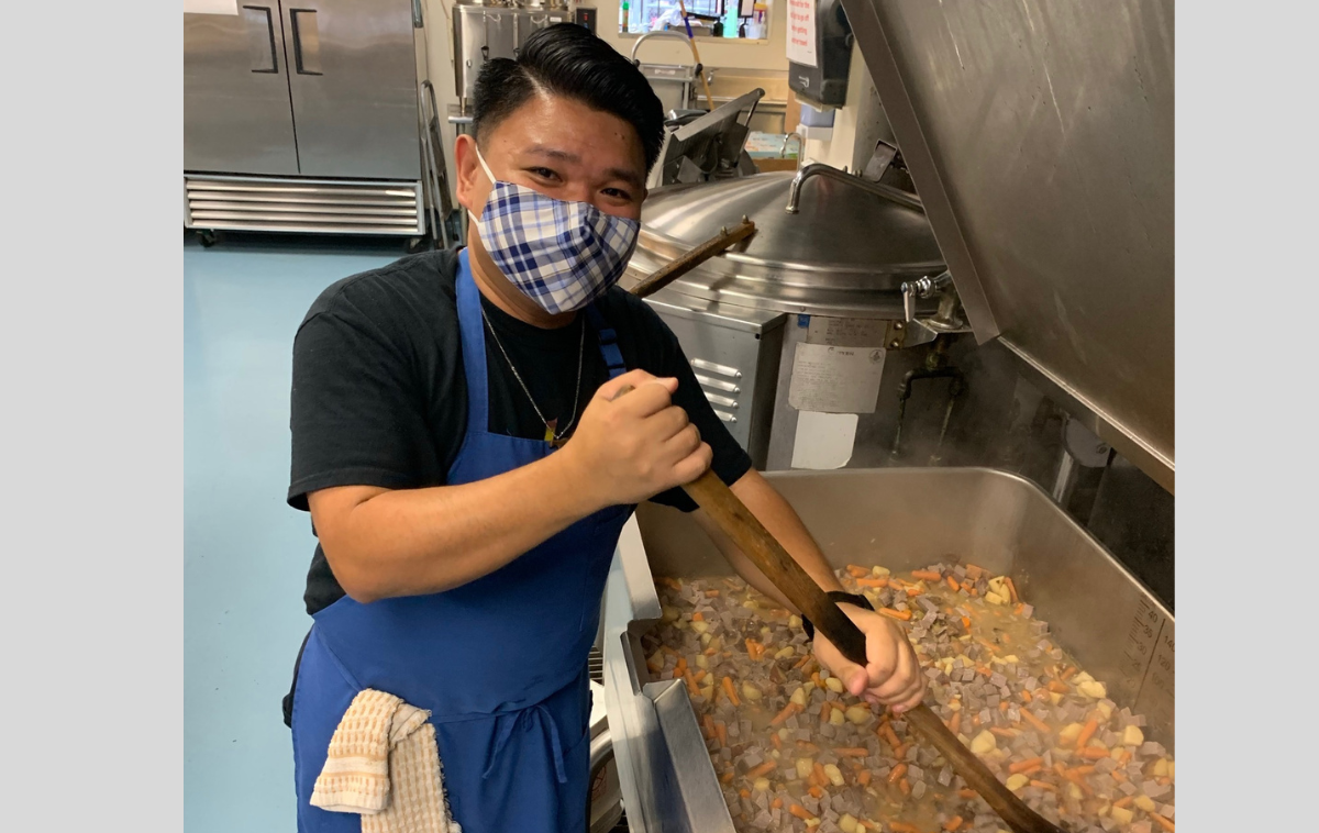 Br. Ricky Ferrer, OFM, FVM alum, puts his cooking skills to use at St. Francis Inn. (Photo courtesy of Br. Ricky